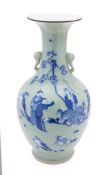 A Chinese underglaze blue and celadon-glazed vase the slender neck with elephant head handles,