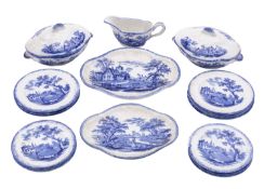 A child's blue and white pottery part dinner service transfer printed with rural landscapes,