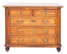 A French oak chest of drawers in early 18th century taste,