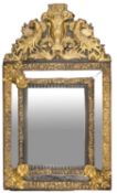 A Dutch repousse gilt brass and ebonised wood marginal wall mirror, in 17th century style,