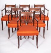 A set of six Regency mahogany and line inlaid elbow chairs,