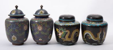 Two pairs of Chinese cloisonne vases and covers decorated with dragons and scrolling flowers,