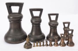 An associated group of thirteen Victorian graduated bronze bell weights,
