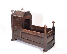 A George I panelled oak child's cradle,