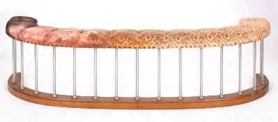 An oak and upholstered club fender,