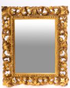 An Italian carved and giltwood dressing table mirror in Florentine 18th century style,