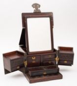 A Chinese hardwood travelling dressing box, late Qing Dynasty with brass mounts,