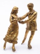 After Vasily Grachev (Russian 1831-1905), a gilt bronze group of a couple ice skating,