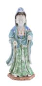 A Chinese porcelain figure of Guanyin wearing blue enamelled headdress,