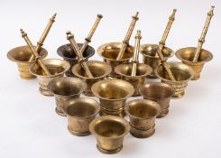 Fifteen various brass mortars and nine associated pestles,