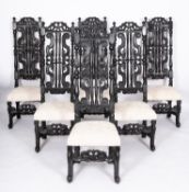 A set of six William & Mary carved and ebonised wood side chairs,