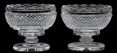 A pair cut glass pedestal bon-bon dishes with hobnail cut bands and on knopped stems, 12cm high.