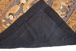 A Burmese kalaga tapestry with raised decoration depicting two figures on an ox cart,