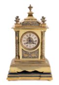 A mid-Victorian French brass mantel clock the eight-day duration movement striking the hours and