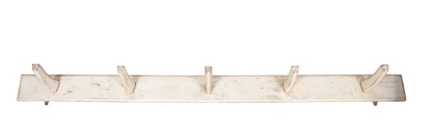 A painted pine wall mounting saddle rack,