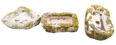 Three rough hewn granite troughs or planters,