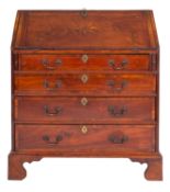 A George II walnut bureau, circa 1740; the fall crossbanded and chequer-strung,