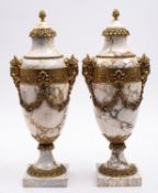A pair of striated white and ochre marble and gilt metal mounted urns in Louis XVI style,