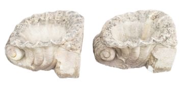 A pair of reconstituted stone planters modelled as cornucopias,