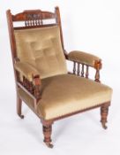 A Victorian carved mahogany and upholstered library armchair,