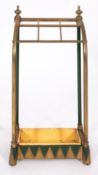A brass and painted cast iron mounted stick stand in Aesthetic Movement style,