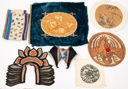 A mixed lot of Chinese textiles including a silk embroidered sleeve band embroidered with
