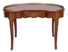 A walnut and gilt metal mounted kidney shaped writing table in Louis XV style,