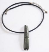 A Pre-Columbian, Costa Rica, green/ grey tube pendant, on a modern leather thong, 7.