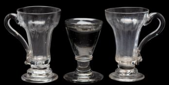 Two syllabub glasses and a firing glass, 18th/19th century the first with ribbed pan-topped bowls,