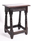 A Jacobean oak joint stool,