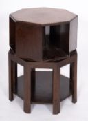 An oak revolving bookcase in the manner of furniture for Heal & Son,