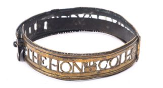A George I pierced brass dog collar dated 1714 with rolled edge and six adjustment slots inscribed