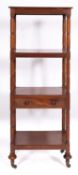A Regency mahogany whatnot with reading stand,