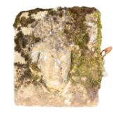 A sculpted sandstone relief of the head of a bishop, in late Mediaeval style,