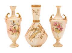 A group of three Royal Worcester blush ivory vases comprising a spiral fluted bottle vase gilded
