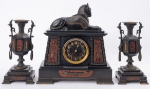 Henry Marc, Paris a black marble and bronze mid-Victorian Egyptian revival mantel clock garniture,