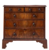 A George III miniature walnut chest of drawers,