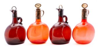A pair of 19th century ruby glass flagon decanters and a pair of similar brown glass decanters with