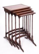 A nest of elm and thuyawood quartetto tables in Regency style,