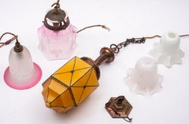 A gilt metal and glass hung five tier ceiling light, early 20th century, with graduated circlets,