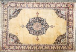 A Turkish carpet, the camel field with a central indigo cartouche pole medallion,