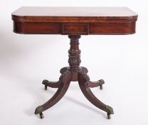 A Regency mahogany folding card table, circa 1815; the rectangular top with rounded front cornice,