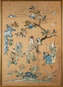A Chinese silk embroidered panel depicting a central figure holding an official's hat with two