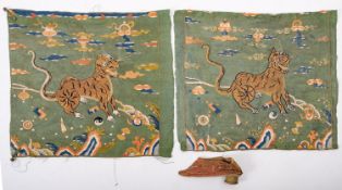 A Chinese child's silk embroidered shoe and two silk embroidered panels each depicting a tiger