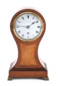 An Edwardian satinwood balloon mantel clock having an eight-day duration single-fusee timepiece