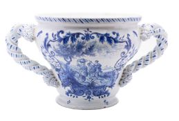 A large Dutch delft jardiniere, of ogee form with robust twisted handles,