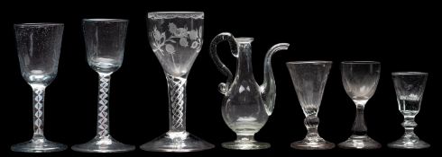 A group of wine and other glasses,