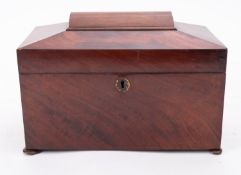 A Regency mahogany caddy, early 19th century; of sarcophagus form,