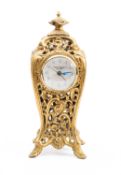 A Peter Rabbit mantel clock having an ormolu cast-brass shaped case,