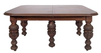 A Victorian carved oak extending dining table, in Elizabethan Revival taste,